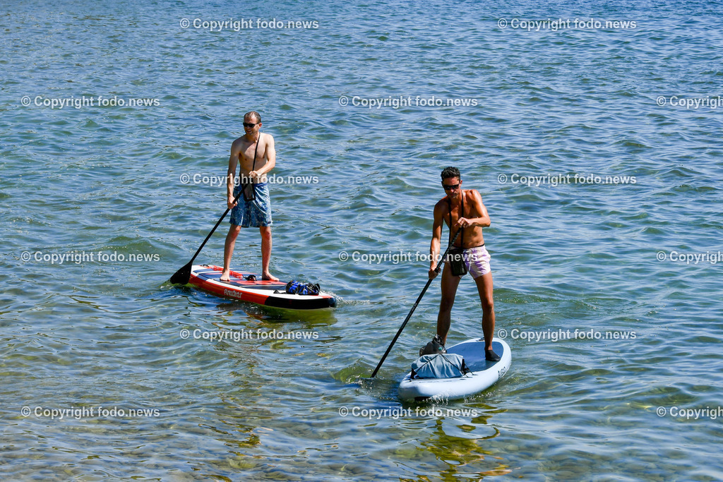 Deutschland_ Baden-Wuerttemberg_ Friedrichshafen am Bodensee_ 19.07.2025-16 | 19.07.2025, Deutschland, GER, Baden Wuerttemberg, Friedrichshafen am Bodensee, im Bild Themenbild, Urlaub, Strand, Sonne, Sommer, See, Ufer, Touristen, Urlauber, Wasser, SUP, Stand up Paddel, Wassersport, Symbolbild, Feature