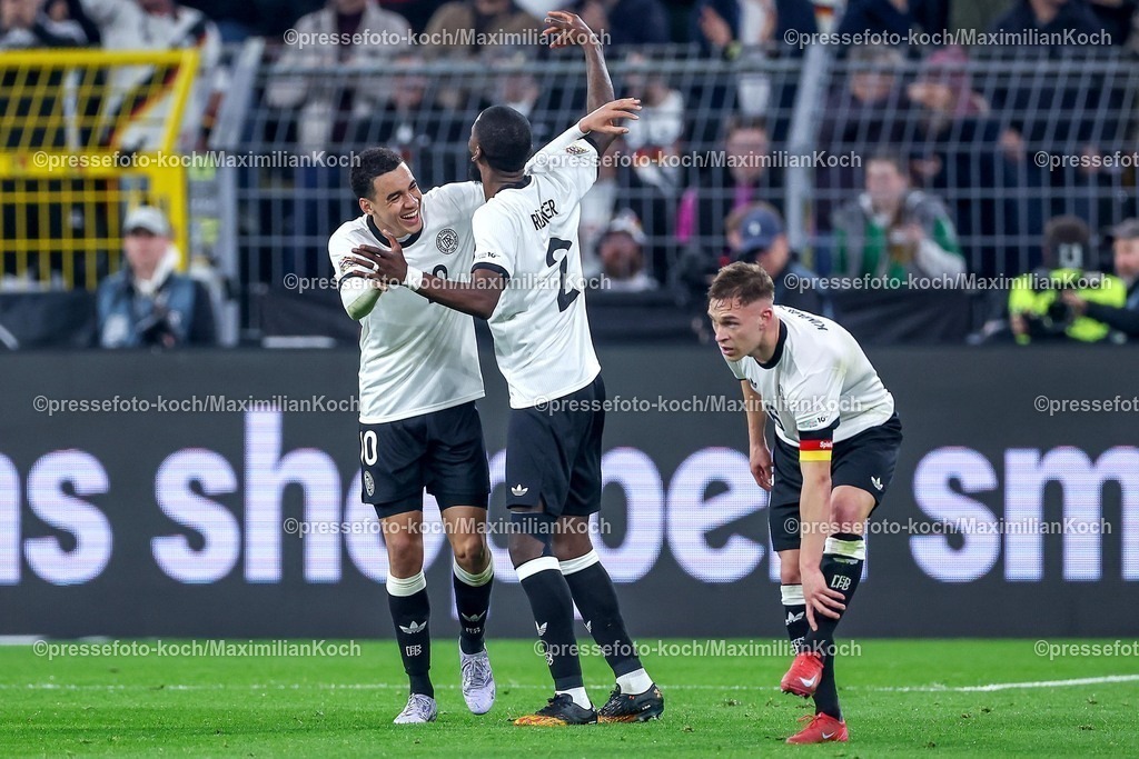DFB23032501030 | 23.03.2025, Fußball, Viertelfinale UEFA Nations League, Deutschland - Italien, Signal Iduna Park, Saison 2024 2025: Torjubel nach dem Tor zum 2:0 durch Torschütze Jamal Musiala (GER #10) zusammen mit Antonio Rüdiger (GER #02) DFB regulations prohibit any use of photographs as image sequences and or quasi-video.