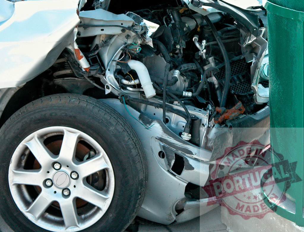 Wrecked car showing engine and internal components after a crash | Broken car with visible engine and internal components after an accident - Realized with Pictrs.com