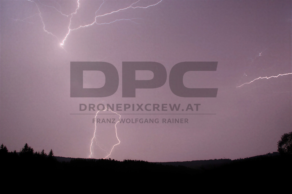 Lightning Storm over the Almenland | Multiple lightning strikes illuminate the night sky over the Almenland region in Austria during a powerful summer thunderstorm. - Realisiert mit Pictrs.com