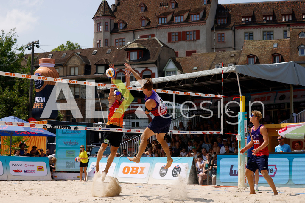 Obi BeachTour 2026 - Basel | BASEL, SWITZERLAND - JULY 19: FLORIAN BREER (SUI) attack / spike against LAURENZ LEITNER (AUT) block during the Obi BeachTour 2026 match between LEITNER / KINDL (AUT) and BREER / KÄLIN (SUI) at Barfüsserplatz on July 19, 2026 in Basel, Switzerland. - Realisiert mit Pictrs.com