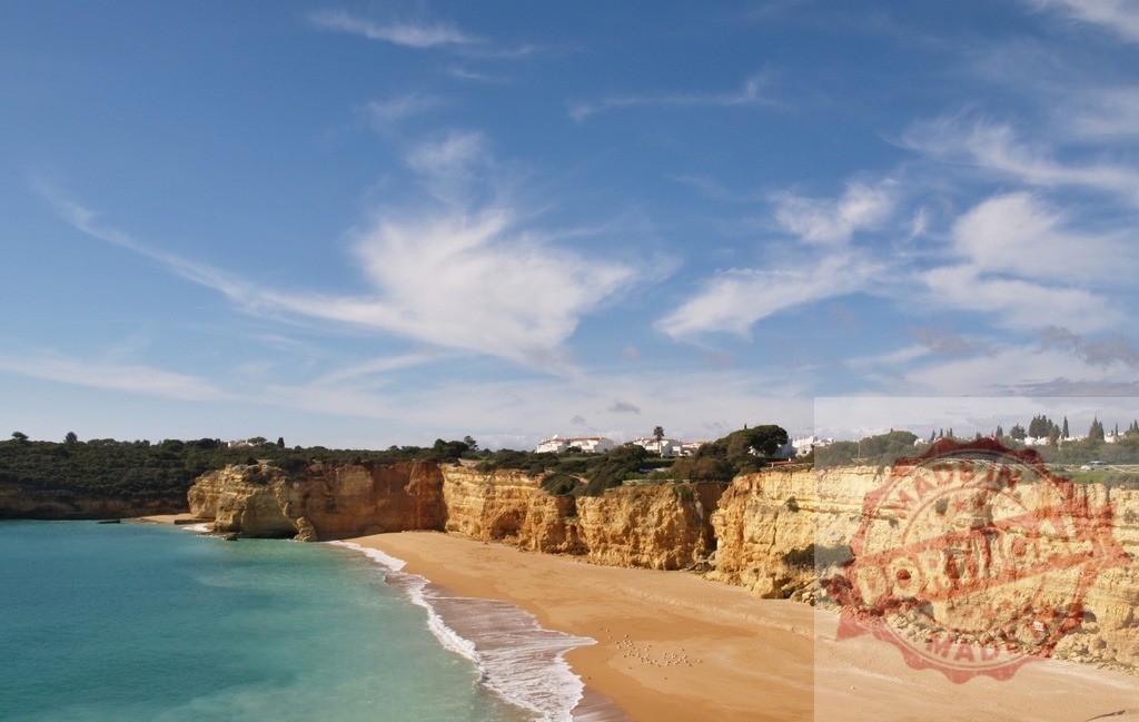 Algarve coast beach with sandstone cliffs and turquoise sea | Praia da Marinha beach in Algarve, Portugal, featuring cliffs, golden sand, and calm turquoise water - Realized with Pictrs.com
