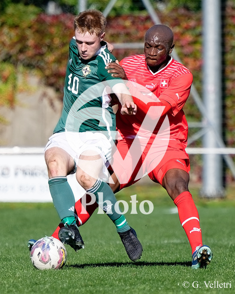 UEFA Region's Cup - NI Western Region v Vaud | Reece Byrne (10 NI Western Region) and Lamine Camara Mamadou (5 Vaud) battle for the ball (duel) during the UEFA Region's Cup game between NI Western Region and Vaud at Centre Sportif de Colovray in Nyon, Switzerland 