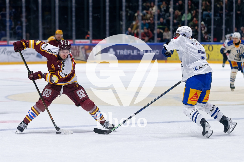 National League - Geneve-Servette HC v EV Zug | Marco Miranda (85 Geneve-Servette HC) battle for the puck (duel) Dorian Moret (7 EV Zug)  during the National League match between Geneve-Servette HC and EV Zug at Les Vernets in Geneva, Switzerland