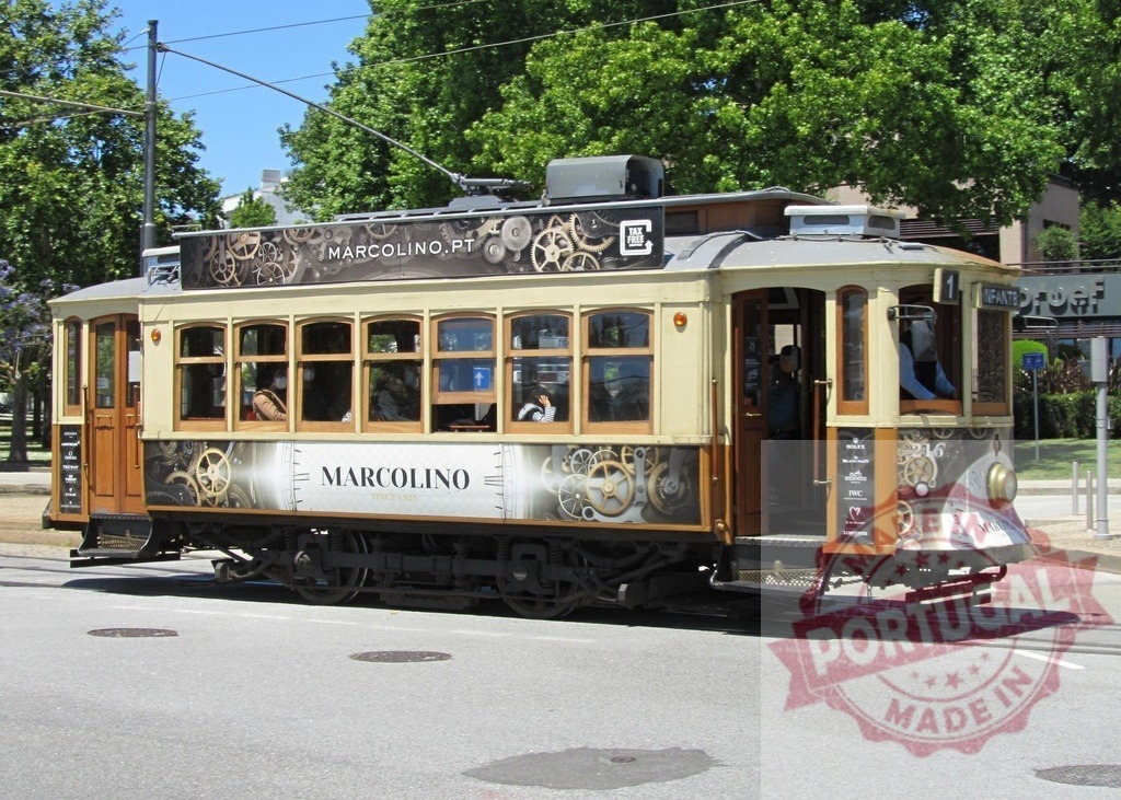 Vintage tram 1 running on city street in Porto, Portugal. Portugal - Norte | Historic tram operating as public transportation in the urban environment of Porto - Realisiert mit Pictrs.com