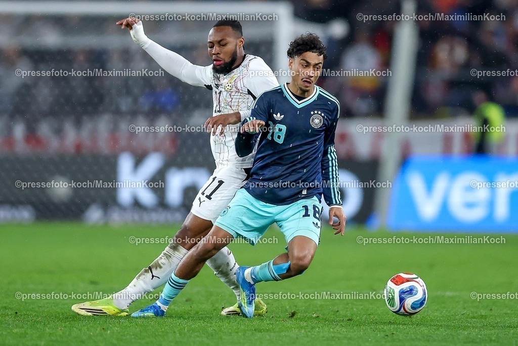 DFB30032600060 | 30.03.2026, Fußball, Länderspiel, Deutschland - Ghana, MHP-Arena (Stuttgart), Saison 2025 2026: Antoine Semenyo (Ghana #11) im Zweikampf gegen  Nathaniel Brown (GER #18)  DFB regulations prohibit any use of photographs as image sequences and or quasi-video.