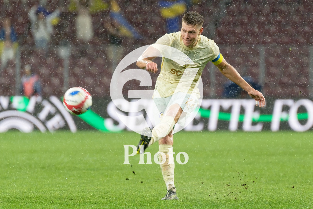 UEFA Conference League Play-offs 2nd leg - Servette FC v FC Shakhtar Donetsk | Mykola Matviyenko (22 FC Shakhtar Donetsk) shoots the ball (action)  during the UEFA Conference League Play-offs 2nd leg match between Servette FC and FC Shakhtar Donetsk at Stade de Geneve in Geneva, Switzerland