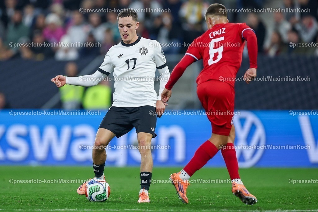 DFB10102502191 | 10.10.2025, Fußball, Länderspiel, Deutschland - Luxemburg, UEFA WM-Qualifikation, 2025/2026, Gruppe A, PreZero Arena in Sinsheim: Florian Wirtz (GER #17) gegen Tomas Moreira (LUX #06) DFB regulations prohibit any use of photographs as image sequences and or quasi-video.