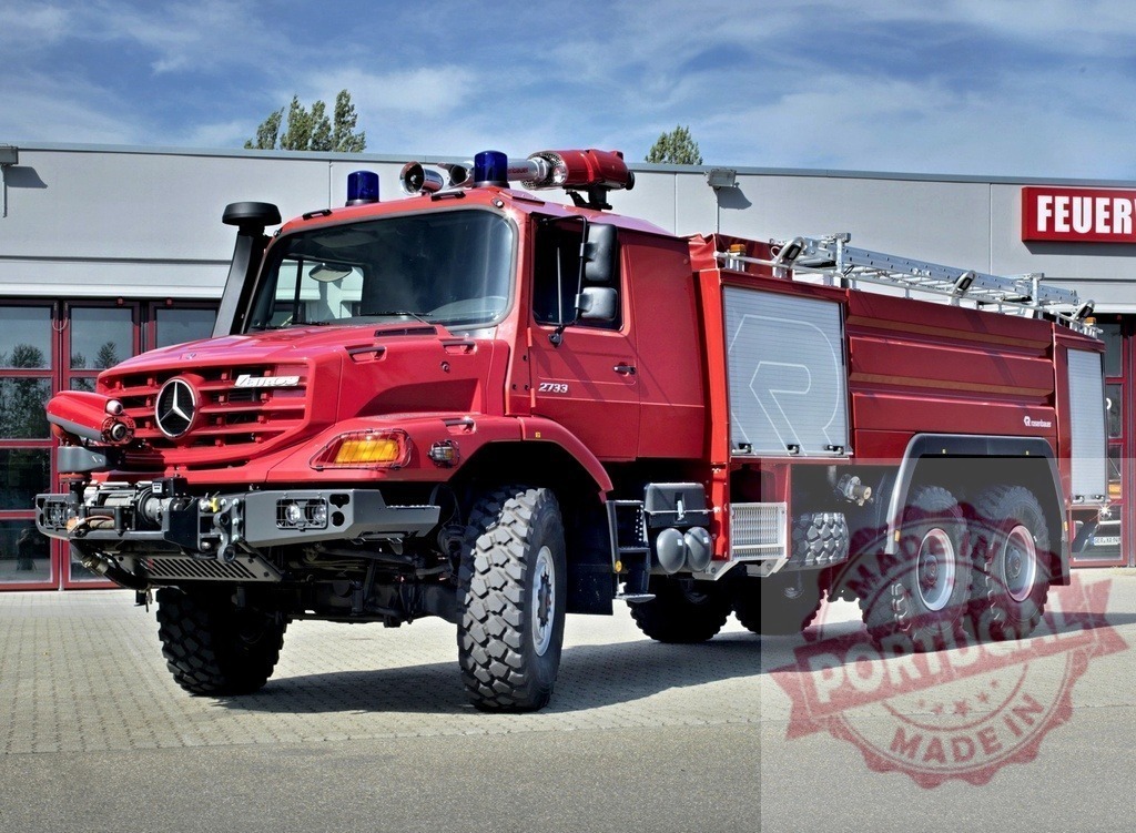 Mercedes-Benz Zetros Rosenbauer fire truck at station | Red Mercedes-Benz Zetros Rosenbauer emergency firefighting truck parked outside a fire station - Realized with Pictrs.com