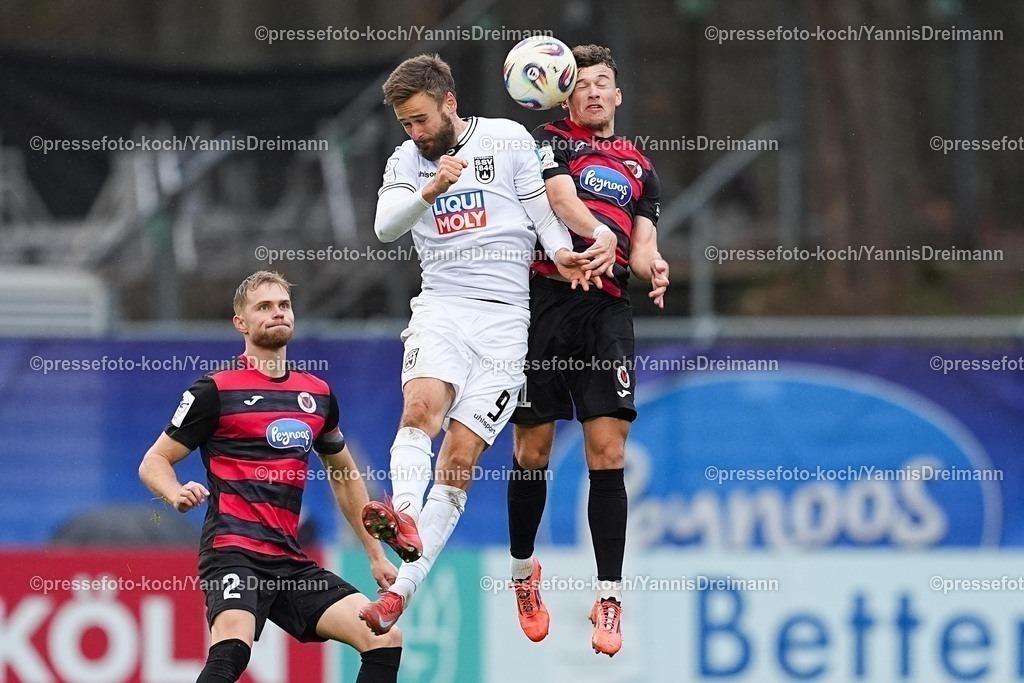 xYDRx06122501037 | 06.12.2025, xydrx, Fußball, 3.Liga, FC Viktoria Köln - SSV Ulm 1846, Saison 2025 2026, Sportpark Höhenberg:  Lucas Roeser (SSV Ulm 1846 #9) im Zweikampf gegen Lucas Wolf (FC Viktoria Köln #21)      DFB regulations prohibit any use of photographs as image sequences and or quasi-video.Photo: xYannisxDreimannxPressefotoKochx