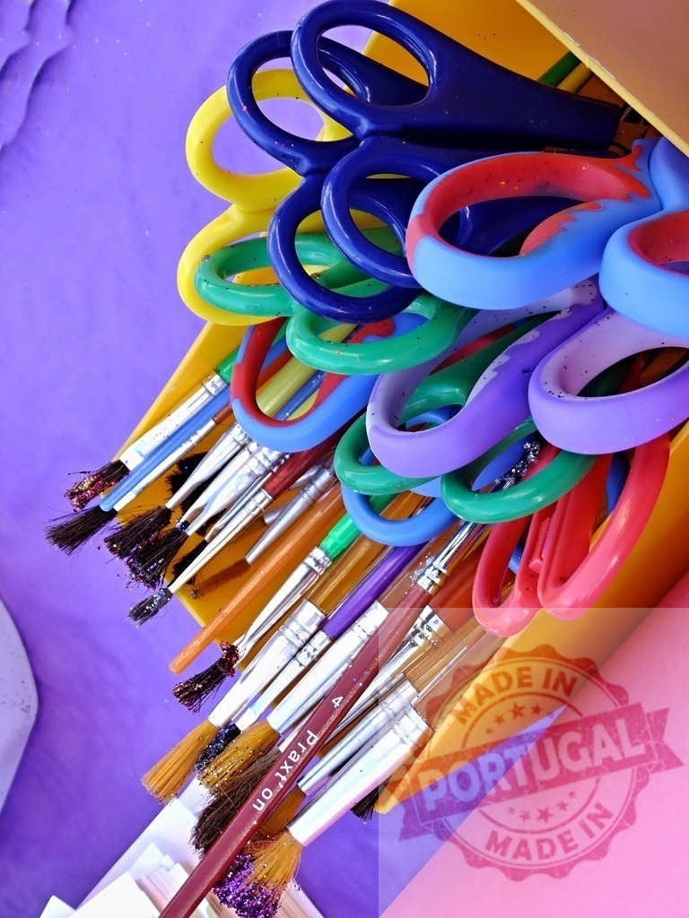 Colorful art supplies in yellow container for creativity | Colorful scissors and paintbrushes organized in a container, representing art and craft activities - Realized with Pictrs.com
