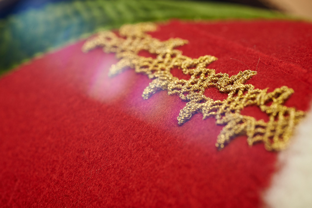 Juppo und Emlmachare | Bezau, Austria - March 09, 2016: Juppo und Emlmachare, Schmuckband aus Goldfaeden-Keadara. - Realisiert mit Pictrs.com