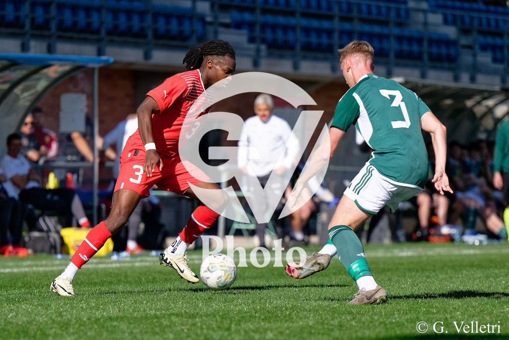 UEFA Region's Cup - NI Western Region v Vaud | Niall Fielding (3 NI Western Region) and Stephane Goncalves Gomes (3 Vaud) battle for the ball (duel) during the UEFA Region's Cup game between NI Western Region and Vaud at Centre Sportif de Colovray in Nyon, Switzerland 