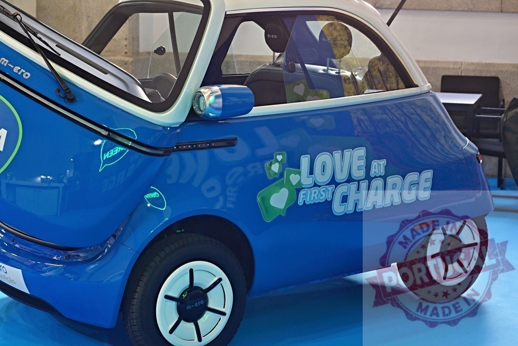 Microlino electric microcar displaying love at first charge | Microlino electric microcar showcasing Love at first charge slogan, symbolizing sustainability and mobility - Realized with Pictrs.com