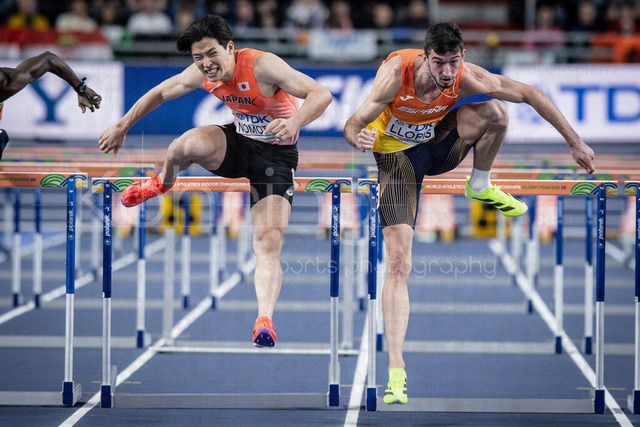 World Athletics Indoor Championships Kujawy Pomorze 26, 21.03.2026 | TORUN, POLAND - MARCH 21:  Shusei NOMOTO (JPN) and Enrique LLOPIS (ESP) competing in the men's 60m hurdles semi-finals of the World Athletics Indoor Championships Kujawy Pomorze 26 on day 2 / session 2 at Kujawsko-Pomorska Arena Torun on March 21, 2026 in Torun, Poland. 