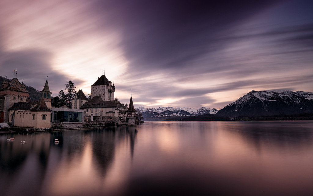 Oberhofen Castle | Schloss Oberhofen
Langzeitaufnahme des Schlosses Oberhofen an einem Wintermorgen vor Sonnenaufgang. 
Durch die Verwendung eines Graufilters sind die Wolkenbewegungen zu sehen und der See wird geglättet. 
------------------------------------------------------------
Long-exposure shot of Oberhofen Castle on a winter morning before sunrise.
By using a gray filter, the cloud movements can be seen and the lake is smoothed.
------------------------------------------------------------
Dieser Druck ist in einer limitierten Auflage von 5 Exemplaren erhältlich. 
This print is available in a limited edition of 5 copies. 
http://art.hess.photography/83-schloss-oberhofen.html - Realisiert mit Pictrs.com