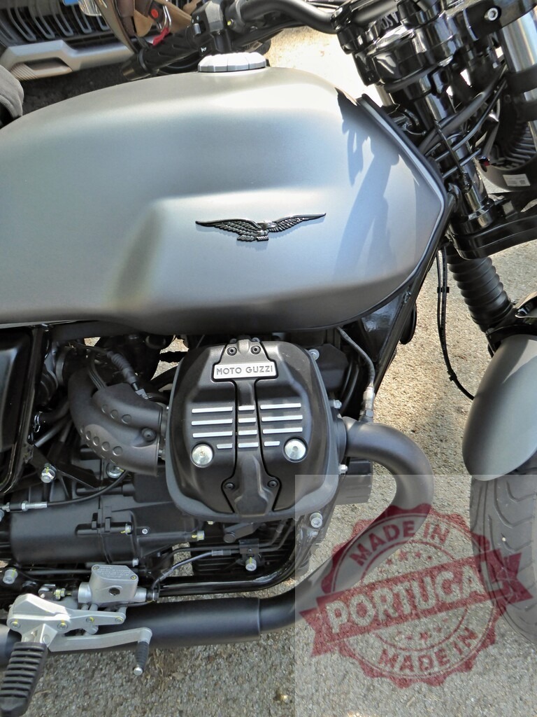 Moto Guzzi v7 special 850 engine and fuel tank detail | Close-up of a Moto Guzzi motorcycle, highlighting the engine and fuel tank details - Realized with Pictrs.com