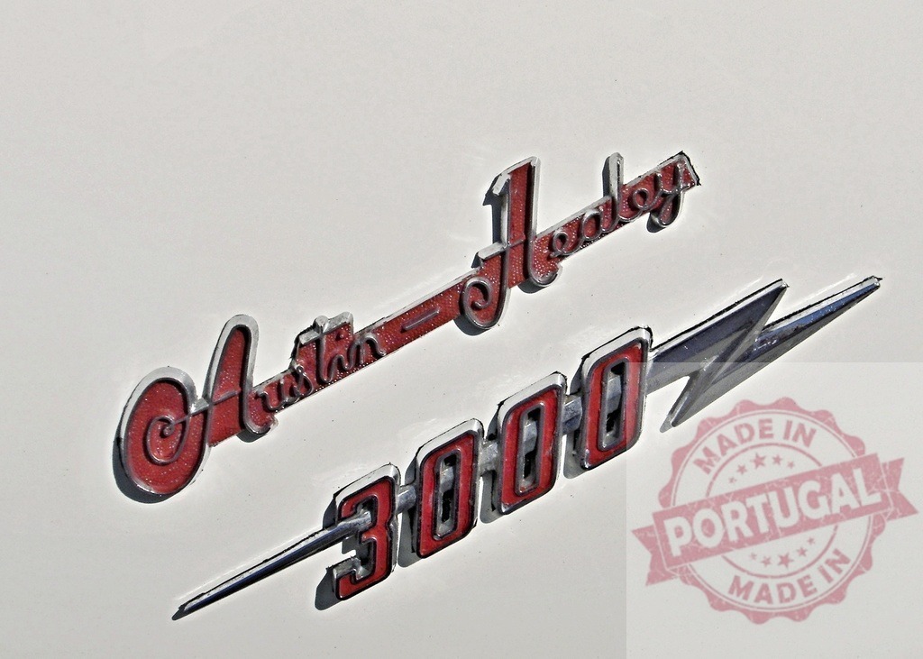 Austin-Healey 3000 badge showing the manufacturer and model of classic british sports car | Close-up of an Austin-Healey 3000 emblem, highlighting the vintage car's brand and iconic model number - Realized with Pictrs.com