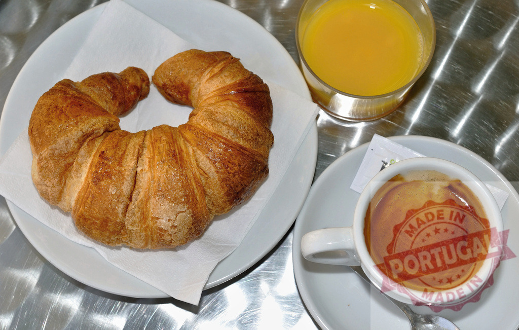 Classic breakfast with croissant espresso and orange juice | Croissant, espresso, and orange juice serving on a table for breakfast - Realisiert mit Pictrs.com