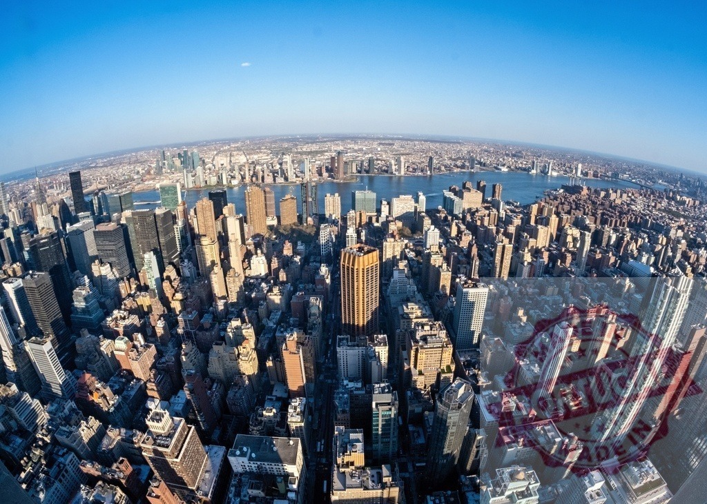 Fisheye view of Manhattan showing skyscrapers and East River under blue sky | Fisheye lens capturing the impressive skyline of Midtown Manhattan with East River under a clear blue sky - Realized with Pictrs.com