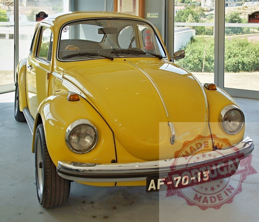 Classic Yellow Volkswagen Beetle in Showroom Display | Vintage yellow Volkswagen Beetle showcased in a bright showroom - Realized with Pictrs.com