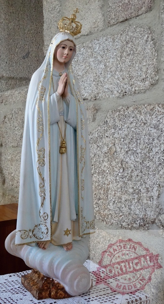 Our Lady of Fatima statue praying on stone background | Our Lady of Fatima statue portraying the Virgin Mary in prayer standing on a cloud - Realized with Pictrs.com