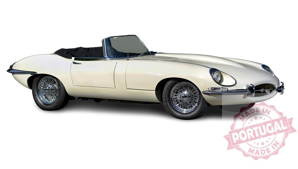 Classic white Jaguar E-Type sports car parked on a white background | Stylish vintage Jaguar E-Type roadster parked, embodying timeless automotive design - Realized with Pictrs.com