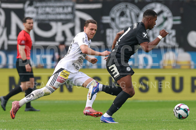 SK Puntigamer Sturm Graz vs TSV Egger Glas Hartberg – Championship Group    | Graz, Austria, 12.Apr.26 - SOCCER - ADMIRAL Bundesliga, SK Puntigamer Sturm Graz vs TSV Egger Glas Hartberg. The image shows Lukas Fridrikas (Hartberg) and Jeyland Mitchell (STU).    
