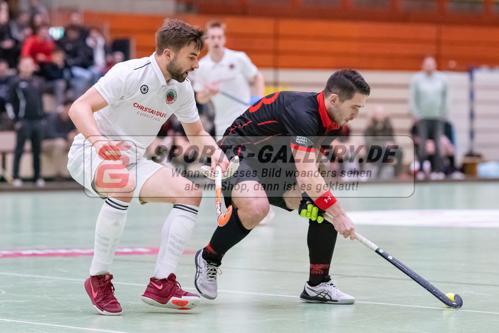 HK_20230113_102716 | 1. Bundesliga ( Halle ) Herren Crefelder HTC - DSD Düsseldorf am 13.1.2023 Crefelder HTC  ( CHTC ) Halle Glockenspitz , Krefeld , Jansen Phillip ( Crefelder HTC #12 ) , Tomasz Gorny ( DSD Düsseldorf #23 )
