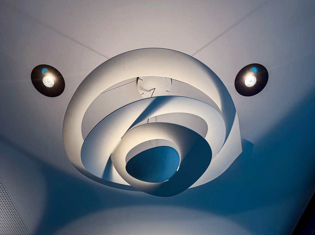Urban Spiral Light | A modern ceiling light transformed into a futuristic spiral composition through perspective, symmetry and urban design aesthetics. - Realisiert mit Pictrs.com