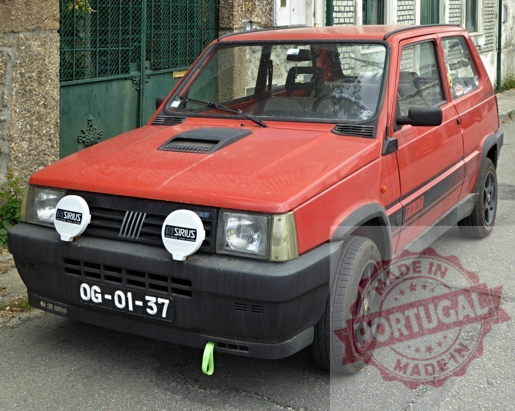 Fiat Panda 4x4 vintage compact car parked on street | Red Fiat Panda 4x4 vintage hatchback parked on a residential street - Realized with Pictrs.com