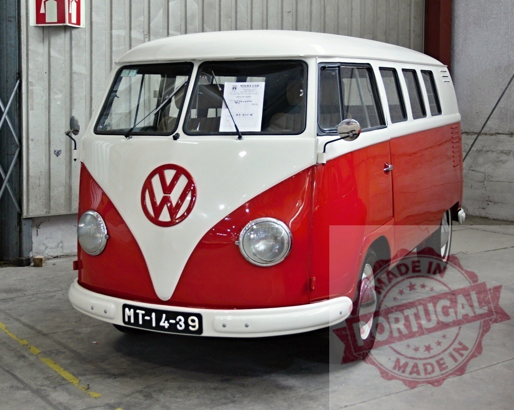 Classic Volkswagen Type 2 Transporter Exhibiting Retro Charm in Garage | Red and white Volkswagen Type 2 Transporter parked in a garage, showcasing its vintage design and historical significance - Realized with Pictrs.com