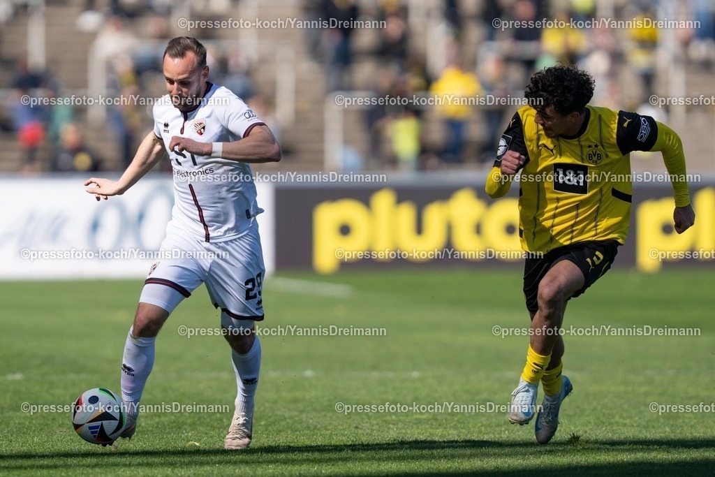 xydr06042501083 | 06.04.2025, xydrx, Fußball, Borussia Dortmund II - FC Ingolstadt 04, 3.Liga, Stadion Rote Erde, Saison 2024 2025: David Kopacz (FC Ingolstadt #29) Antonio Foti (Borussia Dortmund II #5) DFB regulations prohibit any use of photographs as image sequences and or quasi-video.