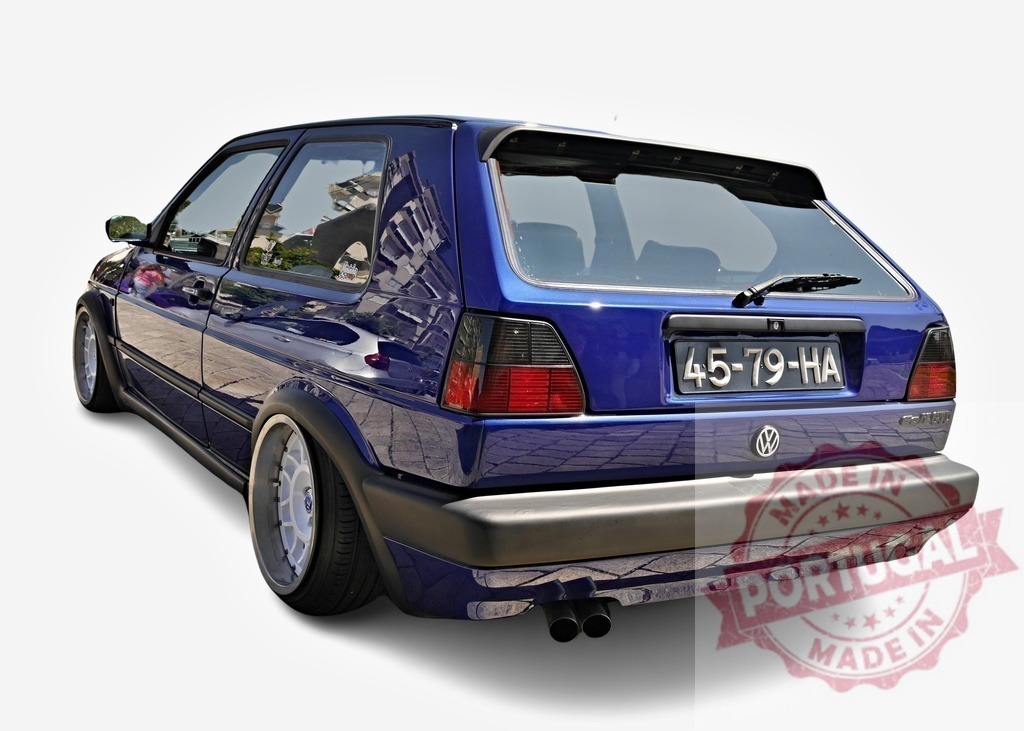 Tuned Volkswagen Golf GTI MK2 showing custom wide body kit | Customized Volkswagen Golf GTI MK2 with wide body kit, lowered suspension and aftermarket alloy wheels - Realized with Pictrs.com