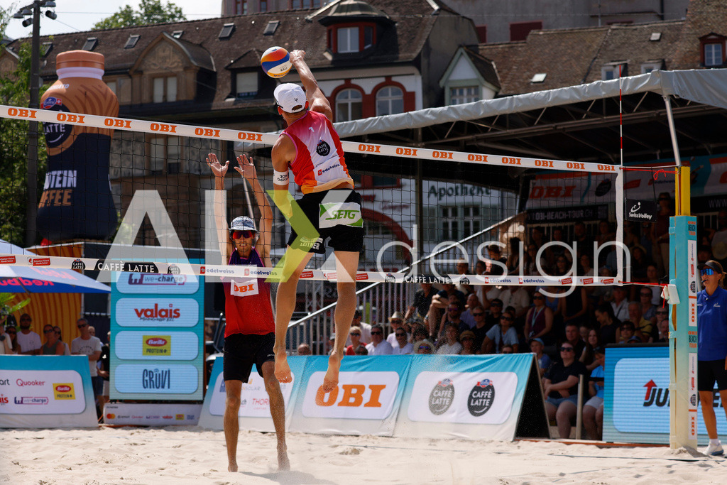 Obi BeachTour 2026 - Basel | BASEL, SWITZERLAND - JULY 19: LAURENZ LEITNER (AUT) attack / spike during the Obi BeachTour 2026 match between HAGENBUCH / HAUSSENER (SUI) and LEITNER / KINDL (AUT) at Barfüsserplatz on July 19, 2026 in Basel, Switzerland. - Realisiert mit Pictrs.com