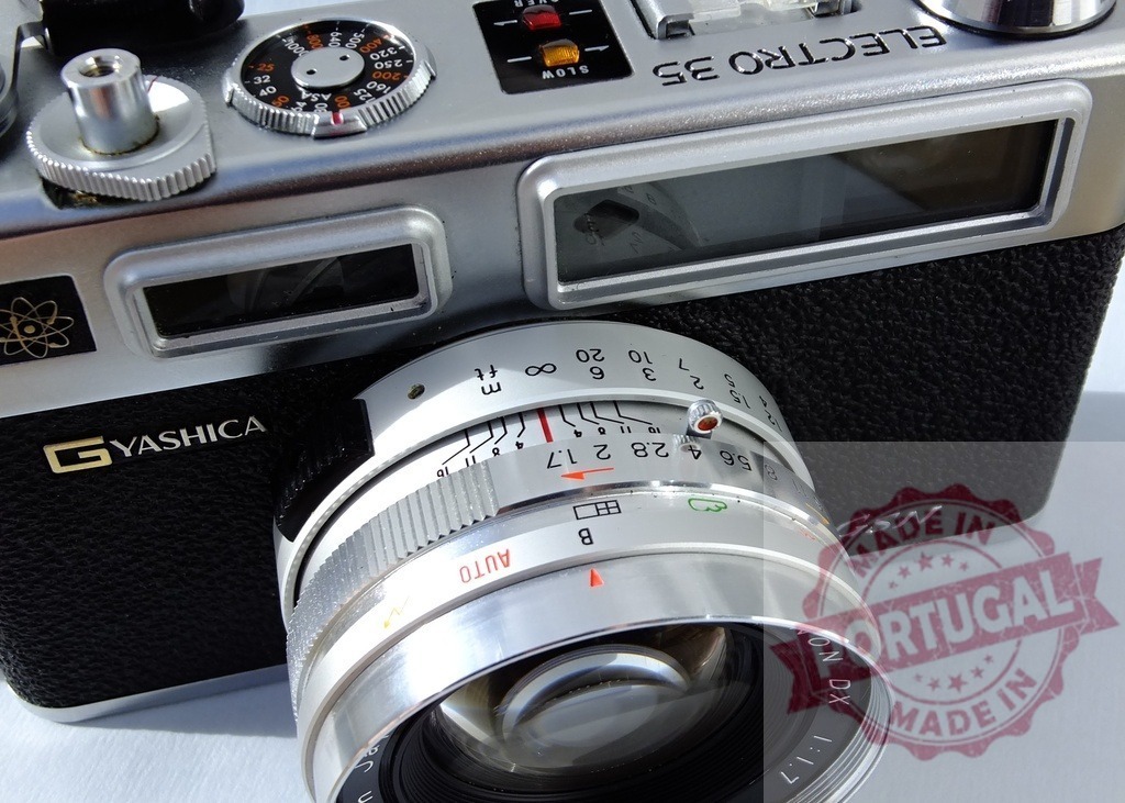 Yashica Electro 35 GSN rangefinder film camera close up | Yashica Electro 35 GSN, a vintage rangefinder camera, showing its silver lens and controls - Realized with Pictrs.com