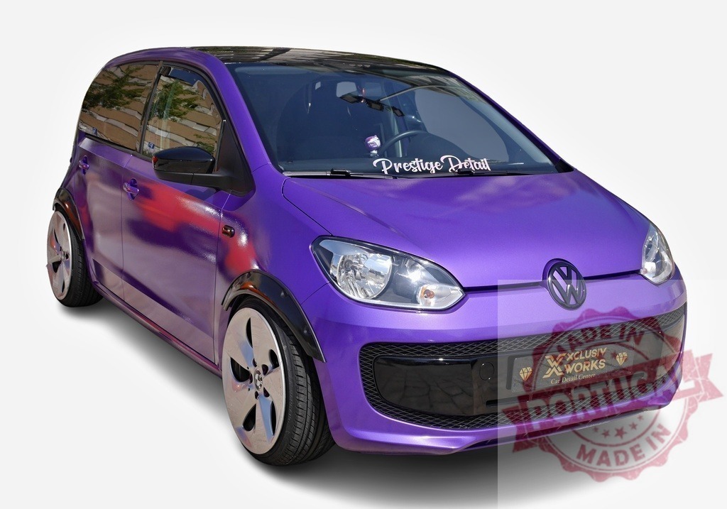 Customized Volkswagen Up! boasting a vibrant purple paint job and aftermarket parts | Tuned Volkswagen Up! showcasing striking modifications, including a custom purple exterior, aftermarket rims, and fender flares - Realized with Pictrs.com