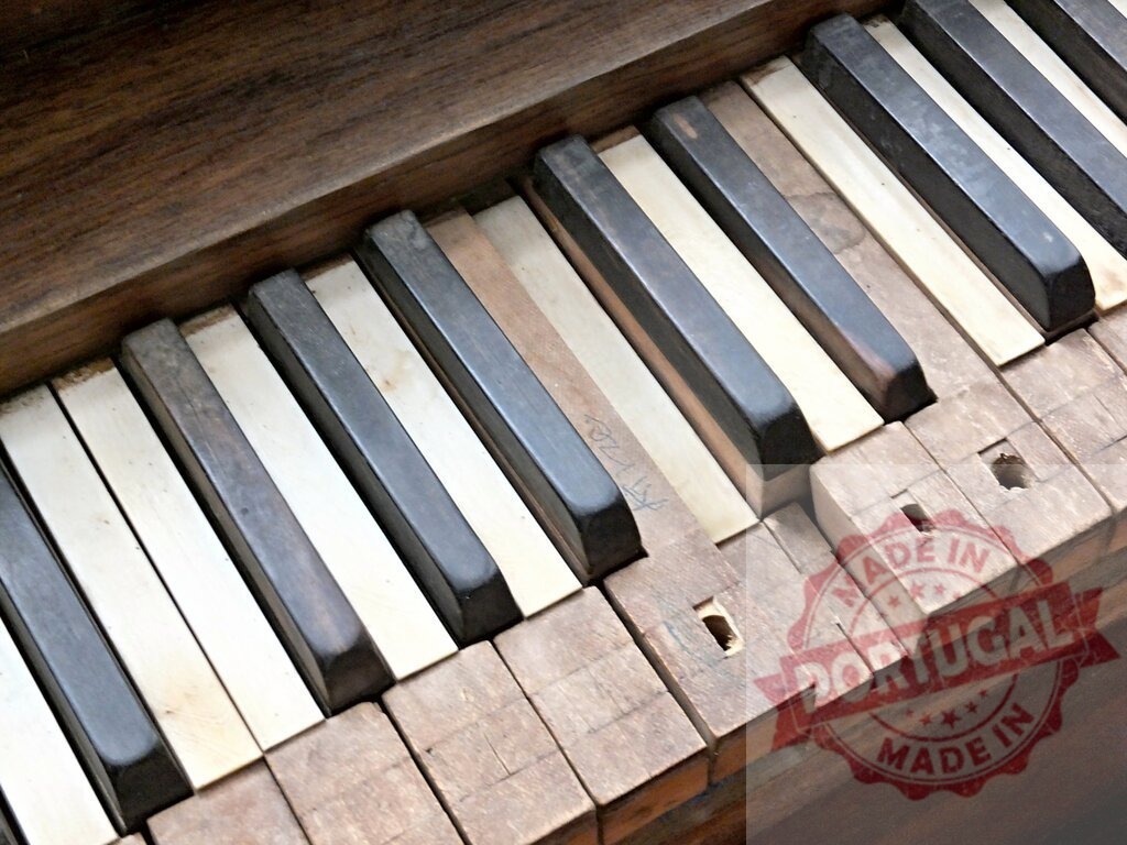 Broken and damaged piano keys showing decay and abandonment | Close-up of broken and damaged piano keys, highlighting decay and abandonment - Realized with Pictrs.com