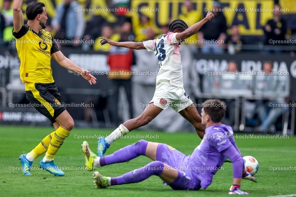 BVB11042601075 | 11.04.2026, Fußball, Borussia Dortmund - Bayer 04 Leverkusen, 1. Fußball Bundesliga, 29. Spieltag, Signal Iduna Park, Saison 2025 2026: Nathan Tella&nbsp;(Bayer04 Leverkusen #23) scheitert an Torwart Gregor Kobel&nbsp;(BVB #01)  DFB regulations prohibit any use of photographs as image sequences and or quasi-video.