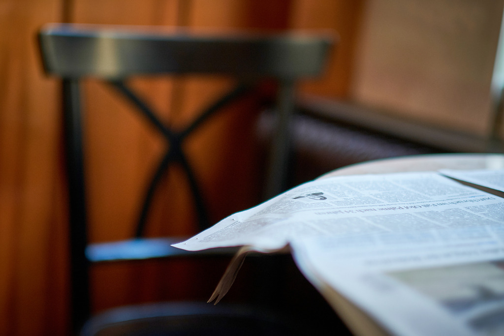 Cafe Volkstheater | WIen, Austria - February 20, 2020: Cafe Volkstheater; eine Zeitung liegt ausgebreitet auf dem Tisch. - Realisiert mit Pictrs.com