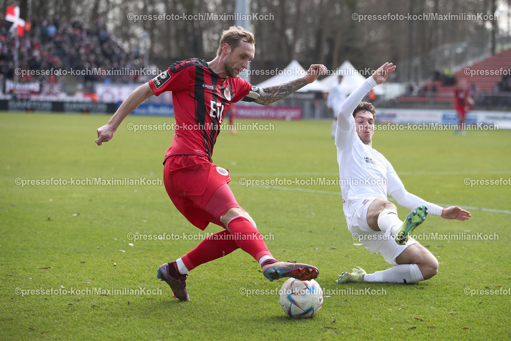 Koe3Liga11032301009 | 11.03.2023, Köln, Fußball, bwin 3. Liga Herren, Sportpark Höhenberg, 26. Spieltag, Saison 2022 2023, FC Viktoria Köln – FSV Zwickau: Marcel Risse von FC Viktoria Köln im Zweikampf gegen Yannic Voigt von FSV Zwickau. DFB regulations prohibit any use of photographs as image sequences and or quasi-video.