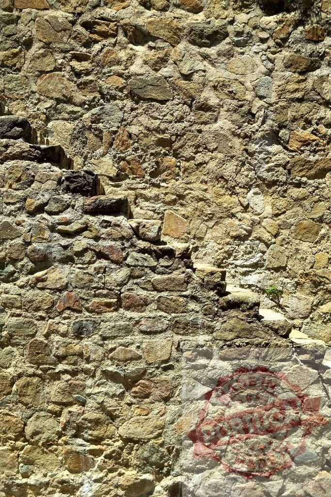 Crumbling stone steps merging with an old weathered wall | Weathered stone wall with crumbling steps merging into the wall, creating an interesting texture - Realized with Pictrs.com