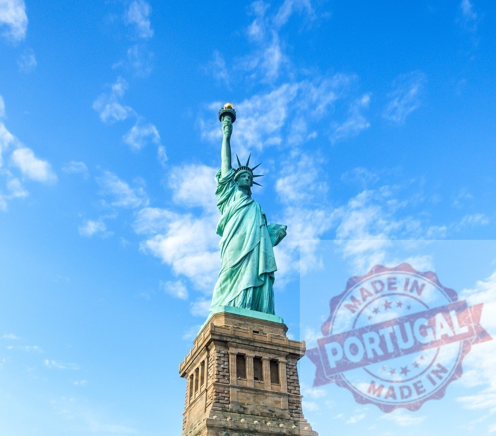Statue of Liberty representing freedom in New York | Statue of Liberty stands against a blue sky with white clouds, symbolizing freedom - Realized with Pictrs.com