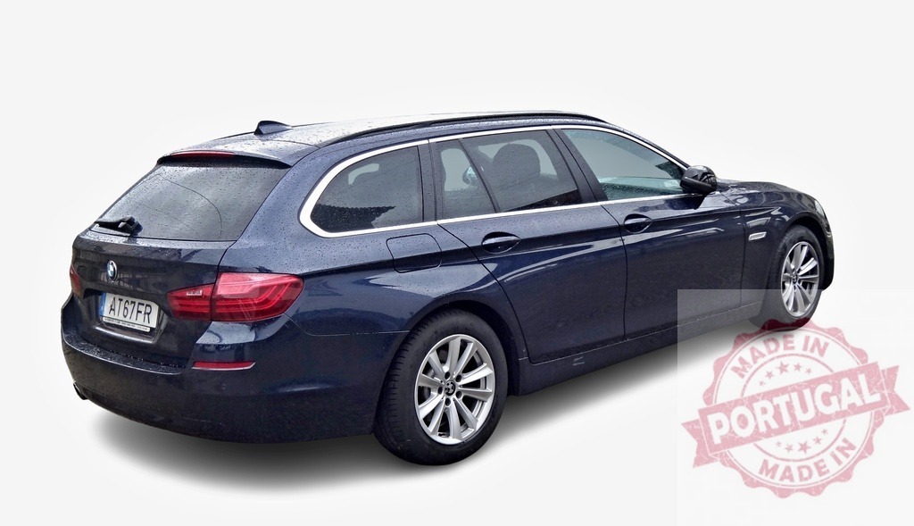 Dark blue BMW 5 series touring parked after the rain | Rear view of a wet BMW serie 5 touring parked on a white background - Realized with Pictrs.com