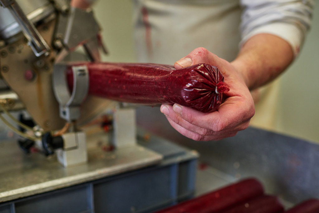 Fleischerei Dormayer | Langenzersdorf, Austria - February 12, 2019: Fleischerei Dormayer - Blutwurst Herstellung; Abfüllen der Masse an der Wurstfüllmaschine. - Realisiert mit Pictrs.com