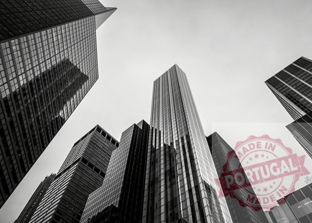 Low angle view of modern skyscrapers rising in Midtown Manhattan, New York City | Imposing skyscrapers rising in black and white in Midtown Manhattan, New York City - Realized with Pictrs.com