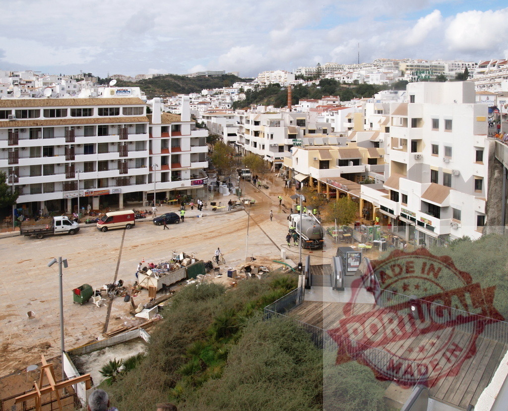 Albufeira flood aftermath cleanup operation with heavy mud | Albufeira Flood - discruction by weather problems Town cleanup workers removing mud and debris after catastrophic flood in Portugal - Realized with Pictrs.com