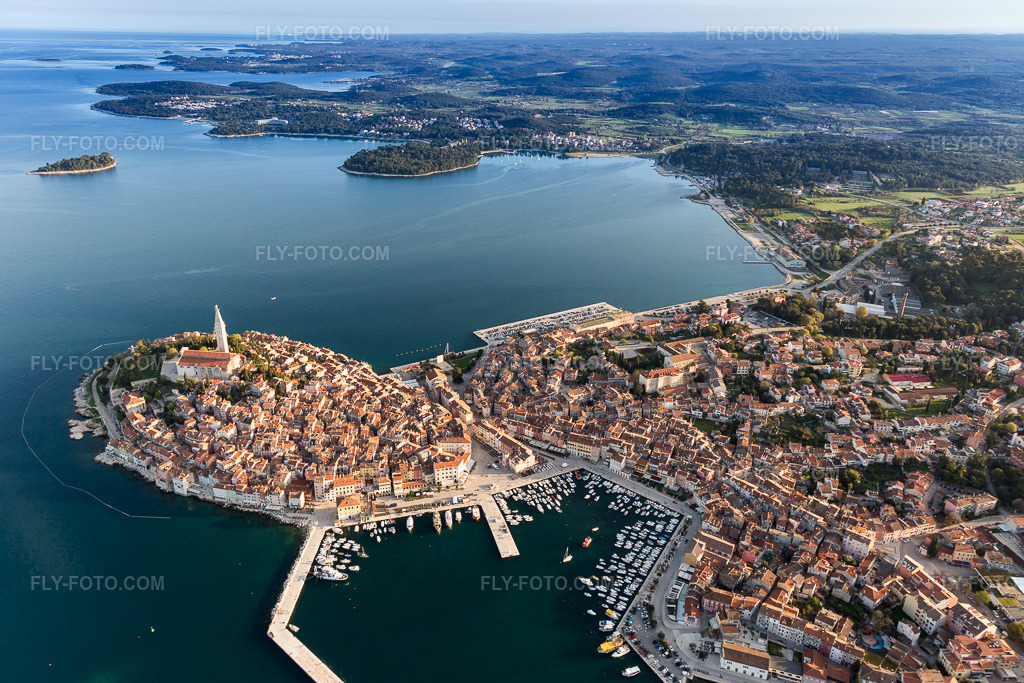 Aerial view: View of the town on the Mediterranean coast near the old town of Rovinj in Istarska Župania - Istria, Croatia. The prominent headland lies on the west coast of the Istrian peninsula. in Rovinj in the state Gespanschaft Istrien, Croatia.Photo: IMG_106282.jpg taken on 04/14/2018 by Werner Riehm/FLY-FOTO.comResolution of the original: 5399 x 3599 px