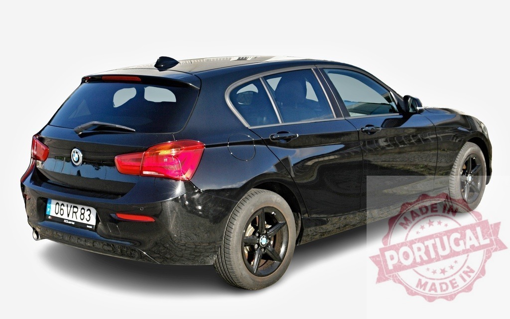 Black BMW 1 series parking assistance showing on dashboard display | Modern black BMW 1 series with parking sensors and rear camera system - Realized with Pictrs.com