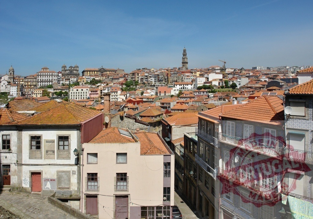 Porto cityscape with Clérigos Tower and terracotta roofs | Overview of Porto, Portugal's historic city with traditional architecture lining steep hills - Realized with Pictrs.com